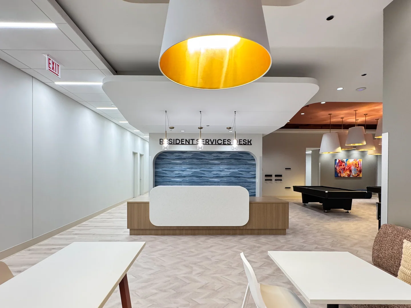 Resident services counter beside a shared lounge