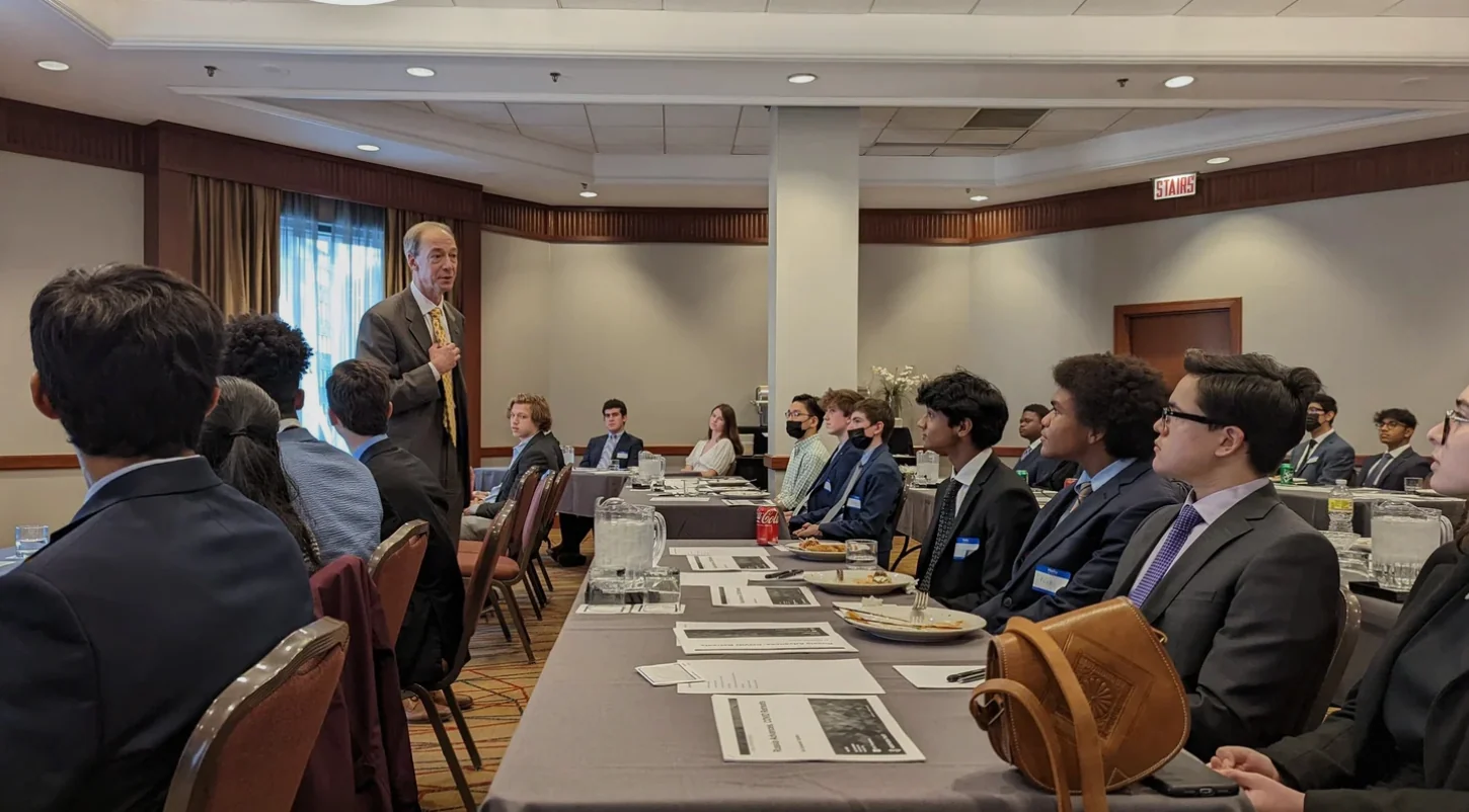 Students attending a business discussion