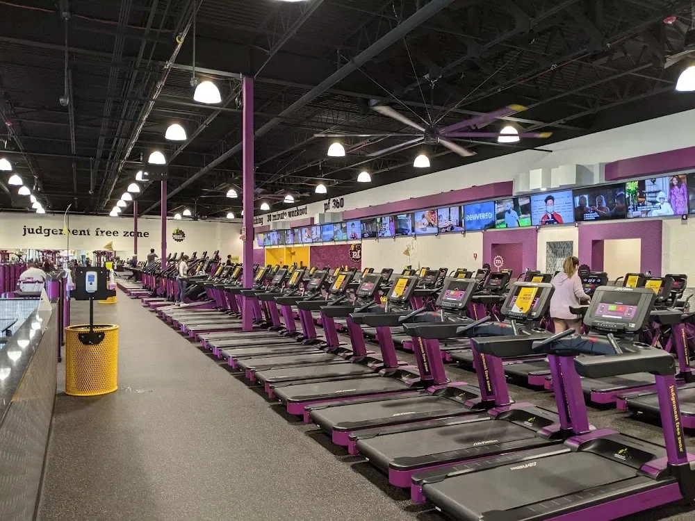 Fitness club with rows of treadmills
